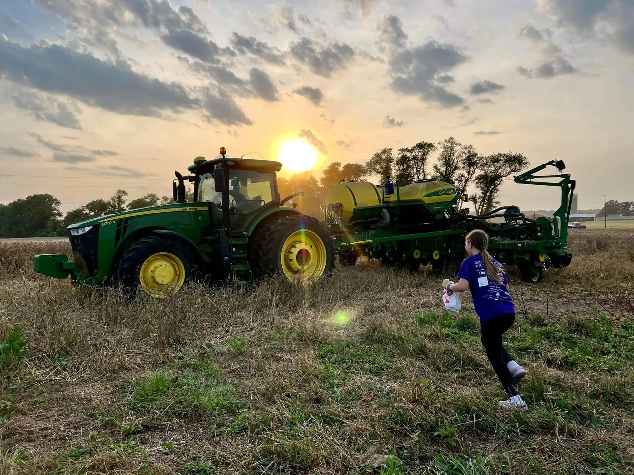Kid running to tractor